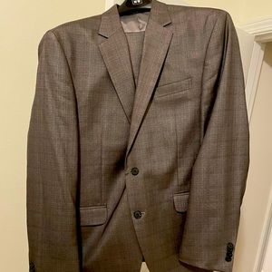 Kenneth Cole Suit. Color is silver and the jacket size is 42R, pants 34x32.